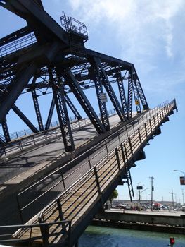 San Fracancisco - June 21, 2010: Historic Third Street Bridge lifts to let a boat go under it.  Bridge is Next to ATT Park in San Fracancisco California.  