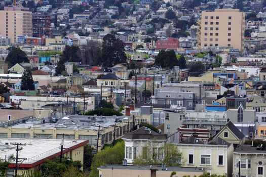 San Francisco -  March 5, 2016: Aerial view of Houses, Cars. Cityscape, streets, and trees of San Francisco in with power-lines and cars parked on street.
