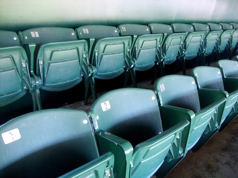 Oakland - June 23, 2010: Two Rows of numbered green seats in stadium.