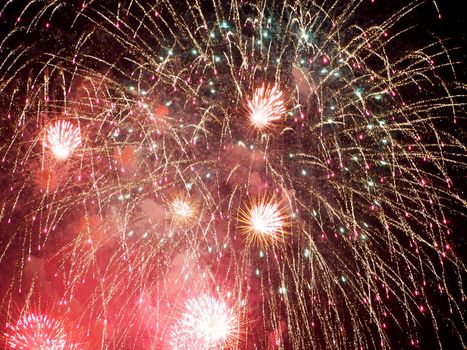 Honolulu - June 4, 2019: Friday night Fireworks with red color burst in the air above Waikiki, Hawaii.