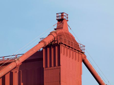 Top of Red Art Deco Tower and supporting cables on the Golden Gate Bridge.