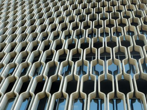 Oahu, Hawaii - May 6, 2013:  concrete grille Wall of Historic IBM Building on Oahu, Hawaii. at 1240 Ala Moana Blvd. which was designed by the famed late architect Vladimir Ossipoff. The most distinctive feature of the building is its concrete grille, which was custom-made and put in place to act as a sunscreen. 