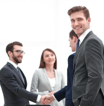 businessman on the background of the company's employees.