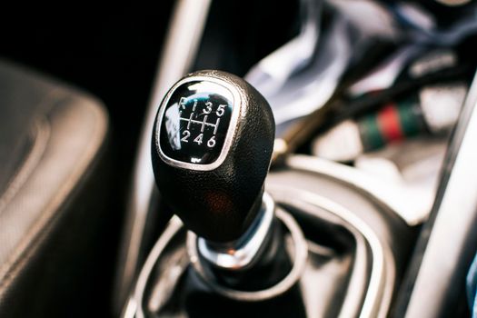 Manual gear lever of a car. Close up of a car gear stick manual transmission, Image of a car gear stick manual transmission.