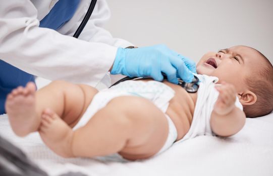 Babies cry at birth because it is the first time they experience separation from love. a little baby having its chest checked by a female doctor