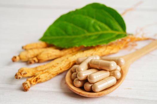 Ginseng roots and green leaf, healthy food.