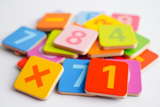 Number wood block cubes for learning Mathematic, education math concept.