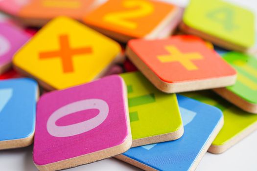 Number wood block cubes for learning Mathematic, education math concept.