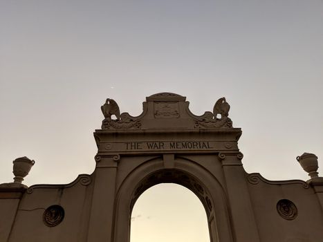 Waikiki -  February 8, 2019:  The Waikiki Natatorium War Memorial at dusk which is a war memorial in Honolulu, Hawaii, USA, built in the form of an ocean water public swimming pool. The natatorium was built as living memorial dedicated to "the men and women who served during the great war" (now known as World War I).