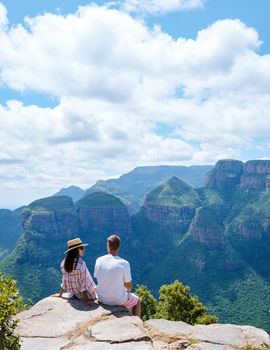 Panorama Route South Africa, Blyde river canyon with the three rondavels, view of three rondavels and the Blyde river canyon in South Africa. Asian women and Caucasian men on vacation in South Africa