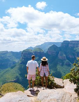 Panorama Route South Africa, Blyde river canyon with the three rondavels, view of three rondavels and the Blyde river canyon in South Africa. Asian women and Caucasian men on vacation in South Africa