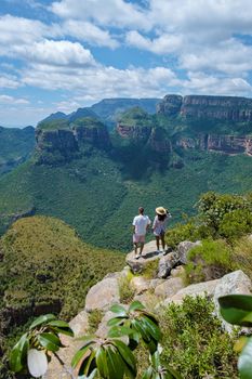 Panorama Route South Africa, Blyde river canyon with the three rondavels, view of three rondavels and the Blyde river canyon in South Africa. Asian women and Caucasian men on vacation in South Africa