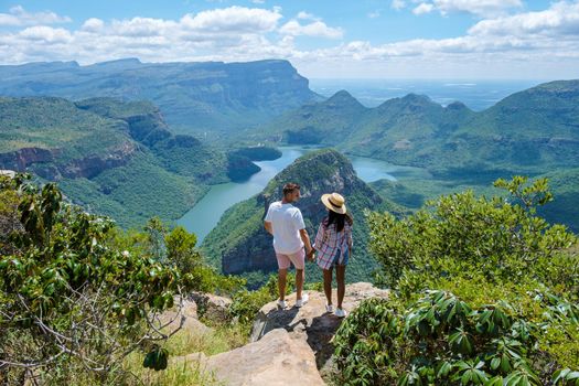 Panorama Route South Africa, Blyde river canyon with the three rondavels, view of three rondavels and the Blyde river canyon in South Africa. Asian women and Caucasian men on vacation in South Africa