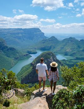 Panorama Route South Africa, Blyde river canyon with the three rondavels, view of three rondavels and the Blyde river canyon in South Africa. Asian women and Caucasian men on vacation in South Africa