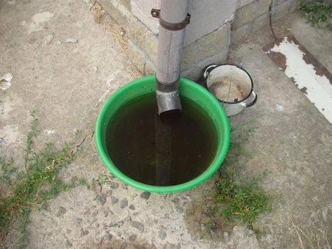 Drinking bowl for animals from rainwater collected from in the roof