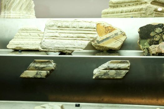 Cartagena, Murcia, Spain- July 17, 2022: Fragments of decorated cornices showed at Augusteum Museum in Cartagena, Spain