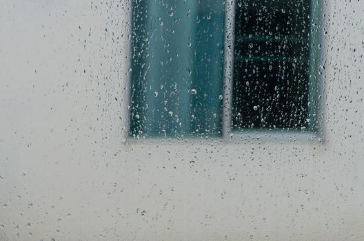 raindrops on the window of the house background