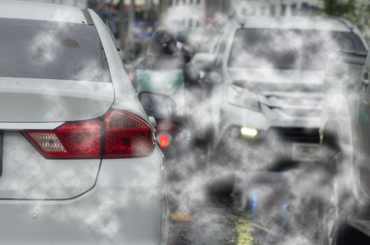 car pollution smoke exhaust automobile pollution traffic jam on road.Car emitting carbon dioxide causing air pollution.