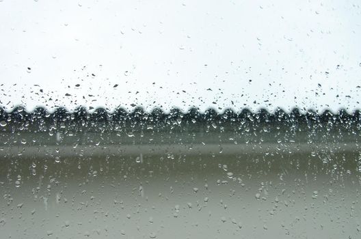 raindrops on the window of the house background