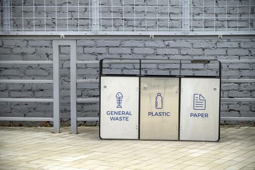 The three different container for sorting garbage. For plastic, paper, metal waste.