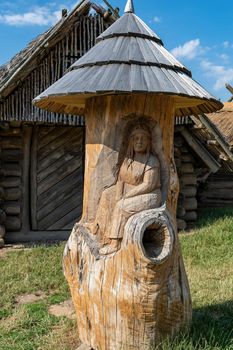 Modra, Czech Republic - July 16. 2022. Historical beehive carved from a tree trunk