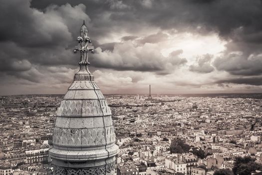 Panoramic view above Paris from Sacre Couer in Montmartre with dramatic storm clouds sky, France