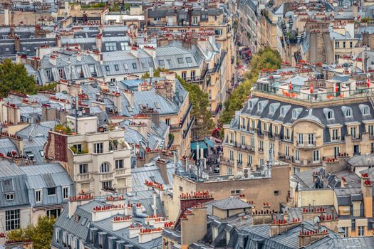 Above alleys and roofs pattern of Montmartre architecture in Paris, France