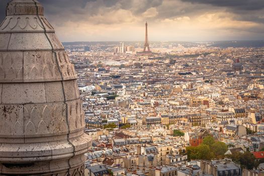 Panoramic view above Paris from Sacre Couer in Montmartre with dramatic storm clouds sky, France