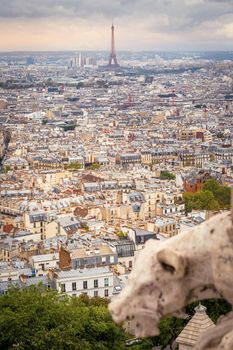Panoramic view above Paris from Sacre Couer in Montmartre with dramatic storm clouds sky, France