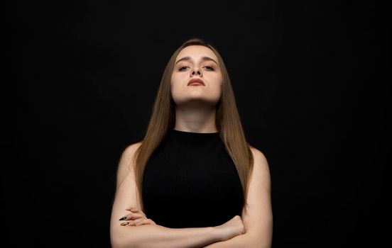 Negative human emotions and feelings. Grumpy young woman posing, frowning eyebrows, her look and grimace expressing anger, annoyance and dislike