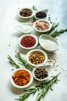 Spices in the bowls as a cooking frame on concrete table