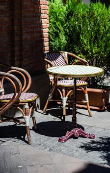 Outdoor cafe with tiny table and chairs in the oldest part of Tbilisi, capital city of Georgia