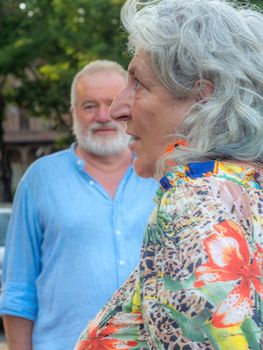 senior elegant man and fashionable lady