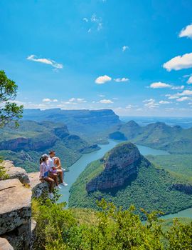 Panorama Route South Africa, Blyde river canyon with the three rondavels, view of three rondavels and the Blyde river canyon in South Africa. Asian women and Caucasian men visiting South Africa