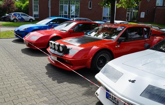 Papenburg, Germany - June 17 2022 Renault Alpine club meeting day. Four Alpines in one row: one blue A110 and three A310 models