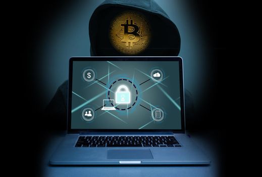 The abstract image of the hacker, laptop, bitcoin. the concept of cyber attack, virus, malware, cryptocurrency, illegally and cyber security