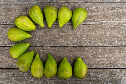 Fresh figs. Ripe figs on a wooden background. Bulk figs close-up.