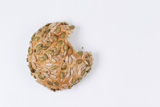detail shot of sunflower seed baked bread on table .
