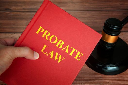 Probate law text on law book with judge gavel on wooden desk background. Law concept