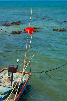 Small Wooden fishing boat coastal drift after returning from fishing