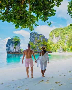 Koh Hong Island Krabi Thailand, a couple of men and women on the beach of Koh Hong, a tropical white beach with Asian women and European men in Krabi Thailand