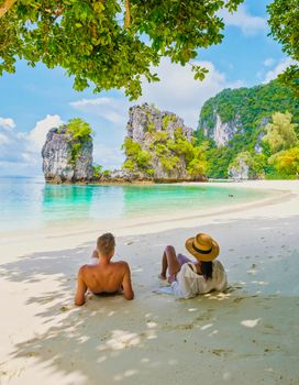 Koh Hong Island Krabi Thailand, a couple of men and women on the beach of Koh Hong, a tropical white beach with Asian women and European men in Krabi Thailand