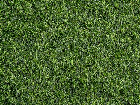 Texture of plastic artificial grass of school yard