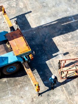 View from the top floor of the industrial plant directly above of truck crane