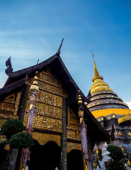 Northern Thai art patterns on various parts of the chapel and pagoda in the temple