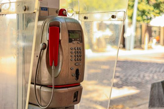 Detail of Old public telephone in the city