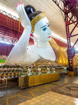 Big white Buddha image in reclining posture