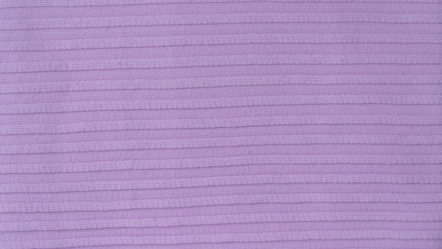 Cotton synthetic fabric is a voluminous horizontal strip of lilac color. High quality photo