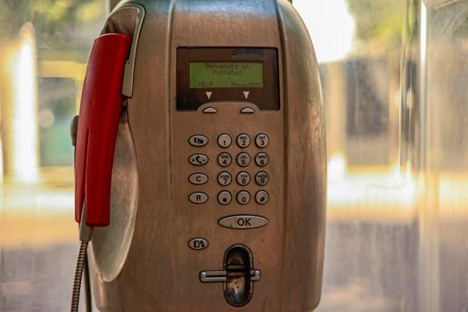 Detail of Old public telephone in the city