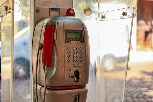 Detail of Old public telephone in the city